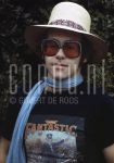 29-06-1976 Elton John in Amsterdam, The Netherlands. June 29, 1976.

[keywords]Sunglasses, Scarf, Hat[/keywords]